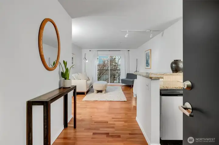 Welcome home. To the left of the door is a spacious coat closet. The kitchen is to your right