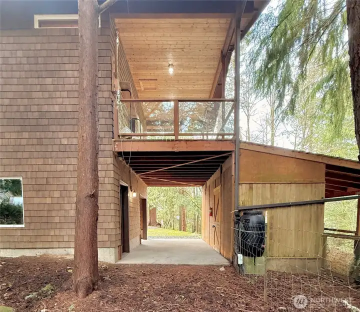 View of barn and storage with family room balcony above.