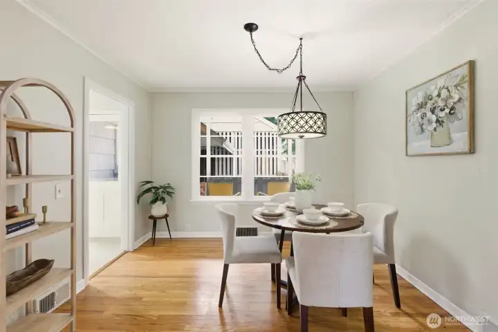 Light-filled dining room adjacent to the kitchen is perfect for hosting dinners.