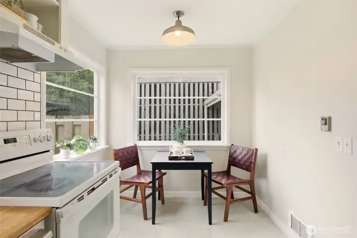 Large breakfast nook offering versatile dining options.