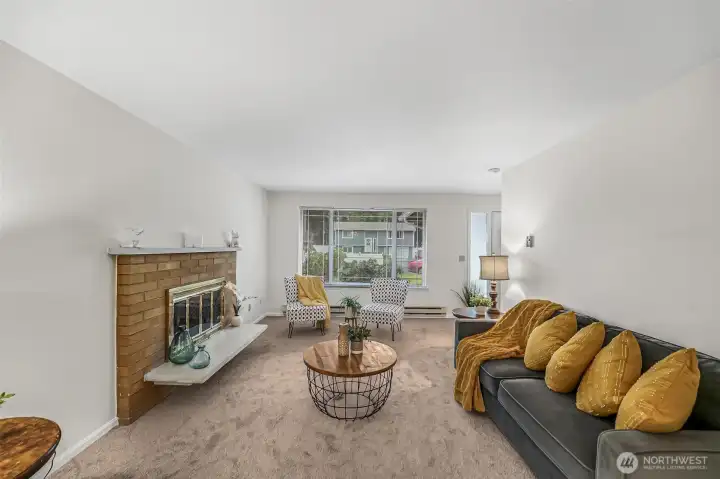Living area with a cozy wood-burning fireplace