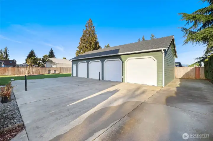Heated 4 Car detached  garage.  posts for pickle ball or tennis.