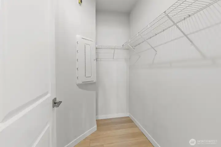 Walk in closet in the primary bedroom.
