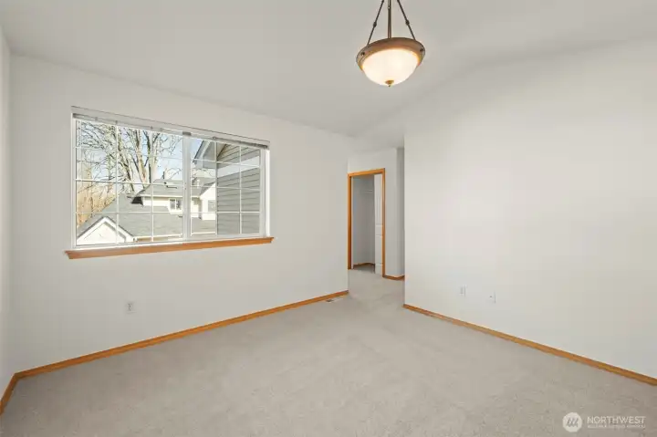 Another view of the HUGE primary bedroom with oversized window