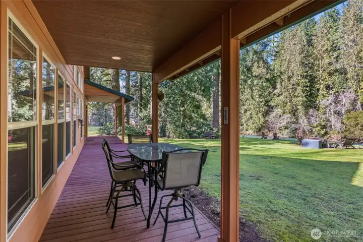 Trex Deck with Covered Seating Areas off Kitchen and Primary Suite. Plumbed for a Gas Grill.