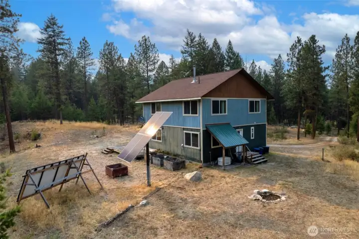Smart Generator under covering, just out the backdoor, off of the utility room