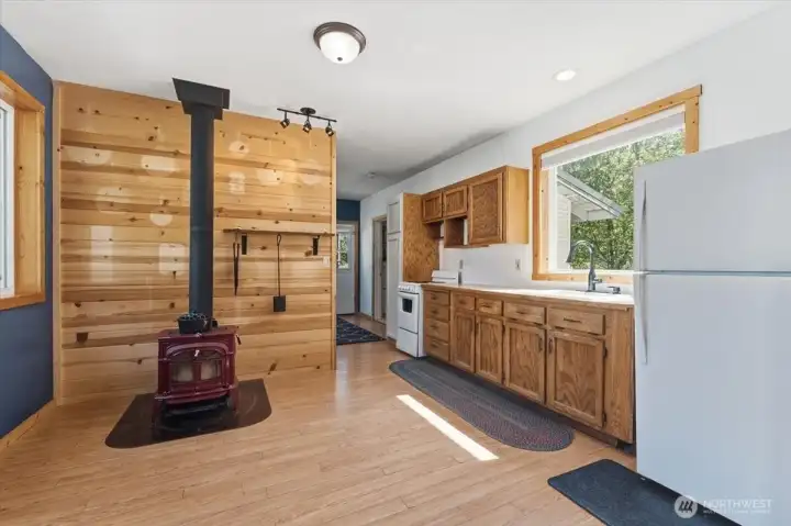 Kitchen & dining area with woodstove.