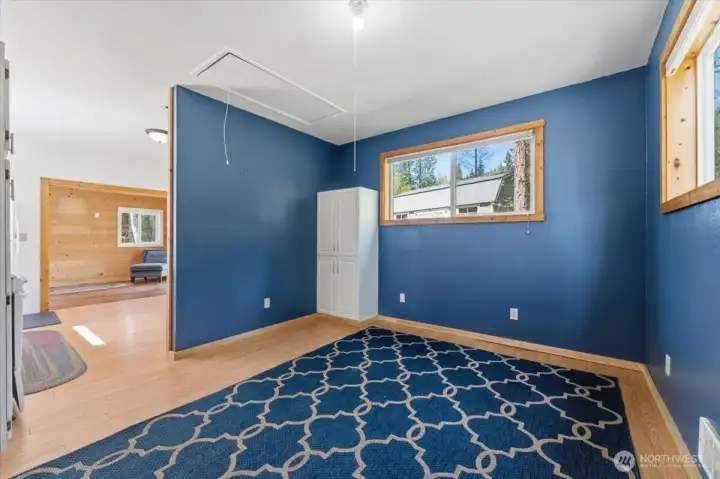 Bedroom area with additional finished storage space in attic area.