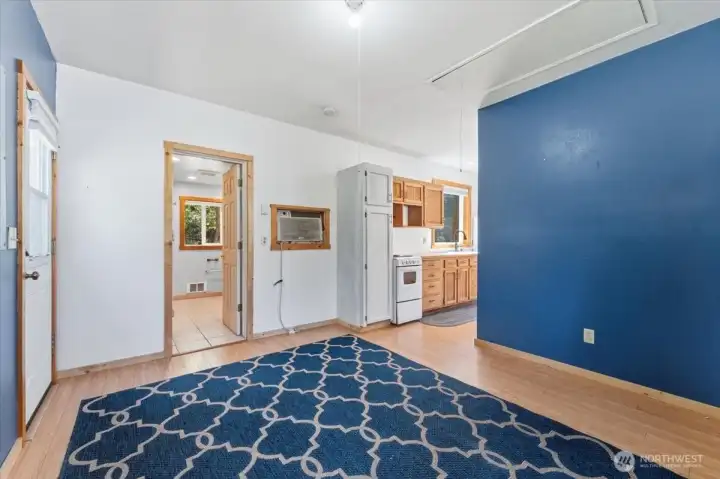 Bedroom looking towards the kitchen and bathroom.