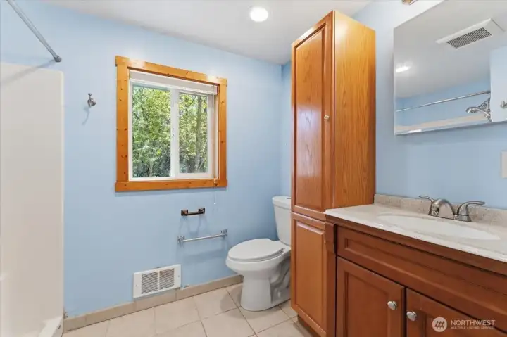 Bathroom with tiled floors.