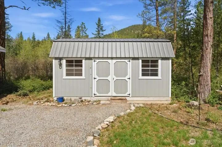 Shed #1: 10' x 20' Old Hickory bunkhouse with metal roof.