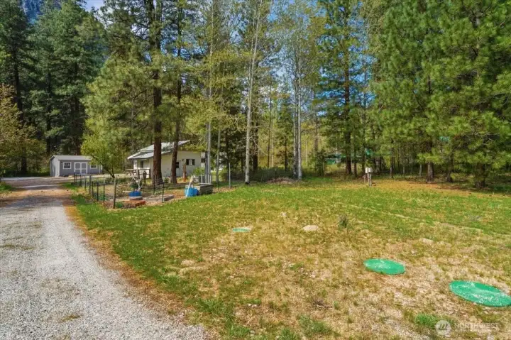 Looking down the driveway with septic system on the right.