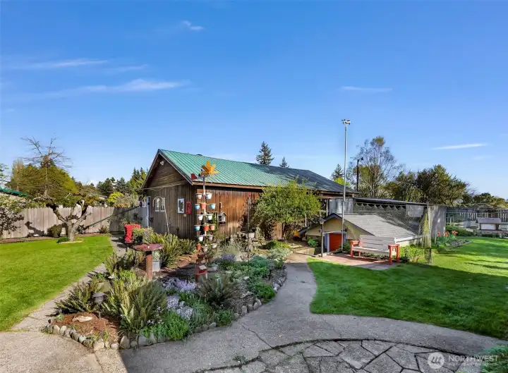 An amazing woodshop with a separate office area and a large attic next to the root cellar