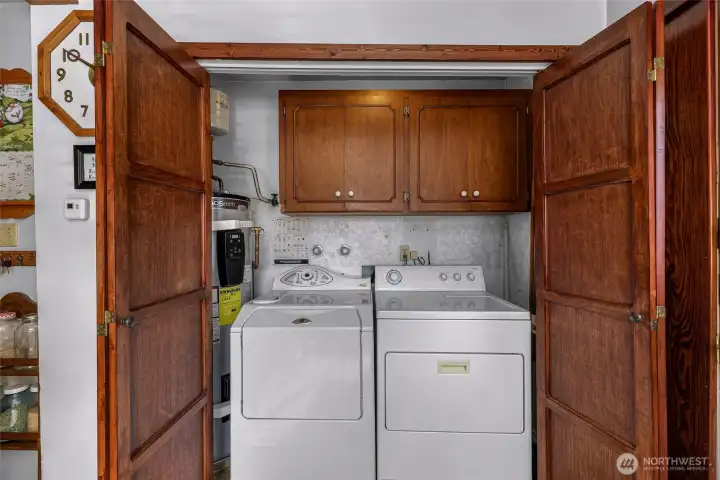 Included washer and dryer in a convenient location with a recent efficient water heater.  Custom built beautiful doors too.