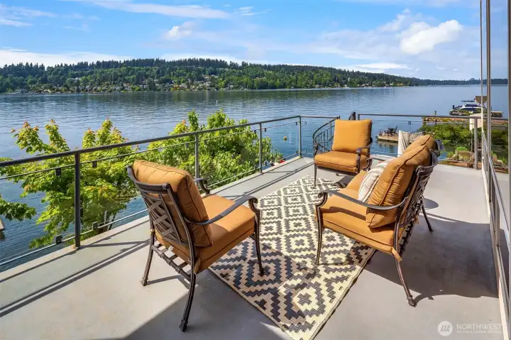 The picturesque deck overlooking the serene lake. The picturesque deck overlooking the serene lake.