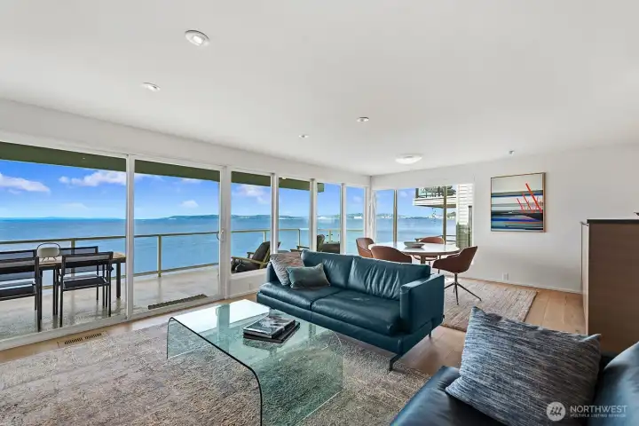Open living and dining with engineered hardwoods, sun shades and sweeping views.