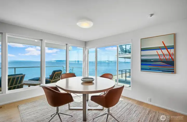 The dining area can accommodate a large table and shares the same magnificent views.