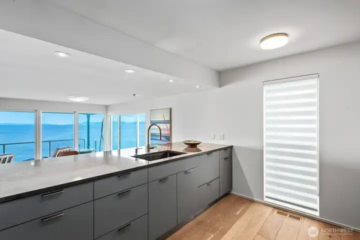 Franks Stainless steel sink with retractable faucet. The chef never misses out on conversation or views.