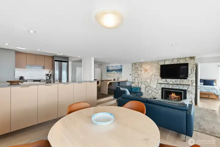 To the right of the fireplace, a discrete door leads to the primary suite.