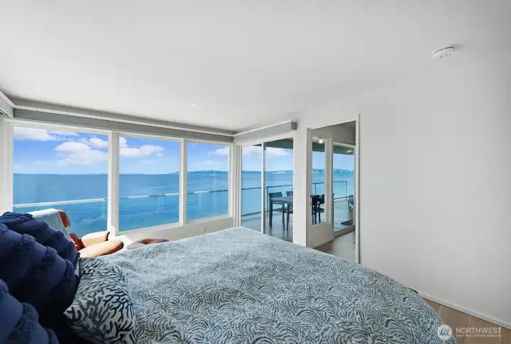 From the primary suite, the same magnificent views and access to the deck. Where better to enjoy morning coffee?