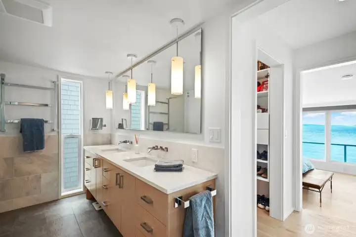 Custom cabinets, walk-in closet and Asko washer and dryer in a separate closet.