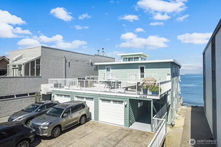 The center bay is dedicated to unit #2. One interior parking space and two tandem outside.