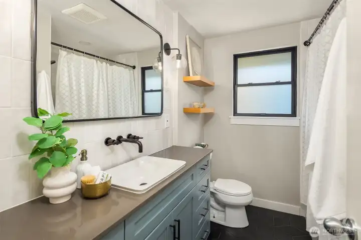 Remodeled full bathroom in the hallway Remodeled full bathroom in the hallway