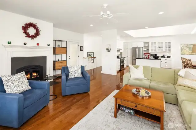 Wood burning fireplace, open concept to kitchen and dining