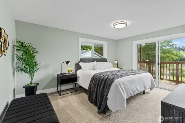 Main house, primary bedroom with ensuite bath, huge walk in closet and priivate access to back deck.