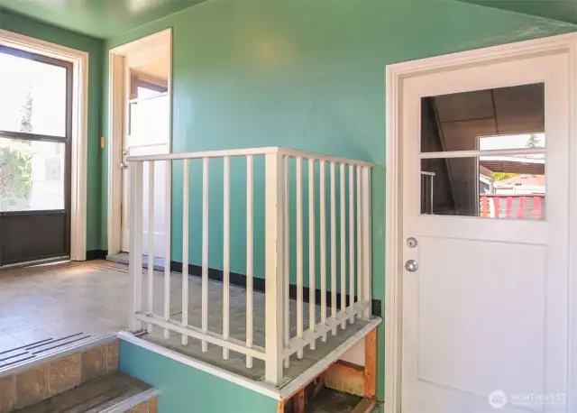 ENCLOSED PORCH WITH ENRY TO BASEMENT