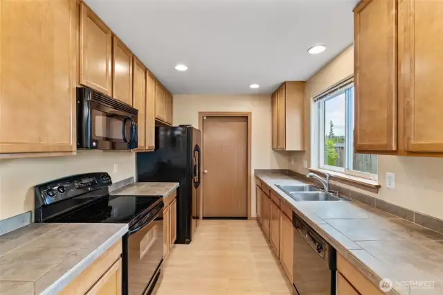Plenty of prep space, bold black appliances, and a layout that works as hard as you do.