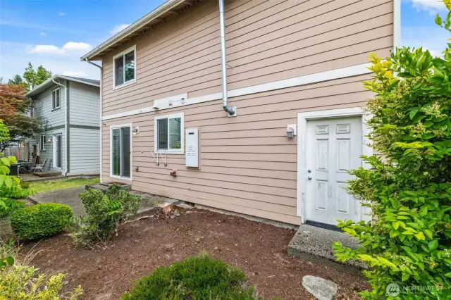 Step straight from your garage into a beautifully landscaped yard.