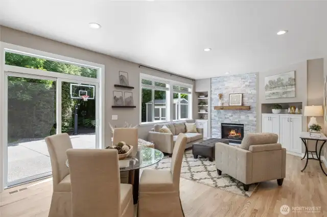 Oversize Sliding Door & Huge Windows frame the beautiful backyard & Wooded 28 Acres beyond.