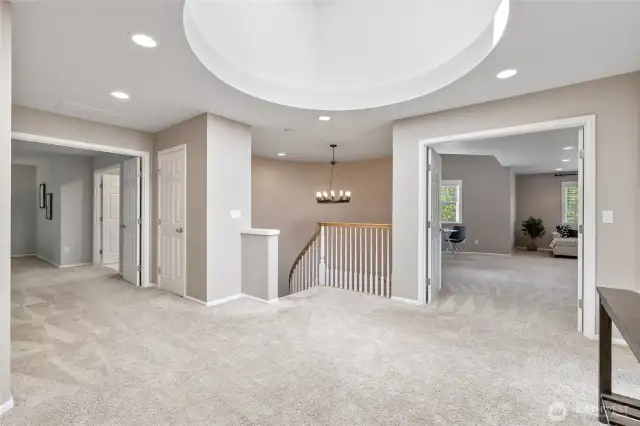 The incredible & light filled landing is such a surprise! French Doors to the Right, Bonus Room ~ French Doors to the Left, Primary Suite
