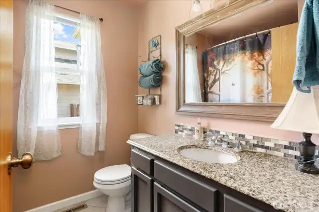 Full bath between the primary and second bedroom