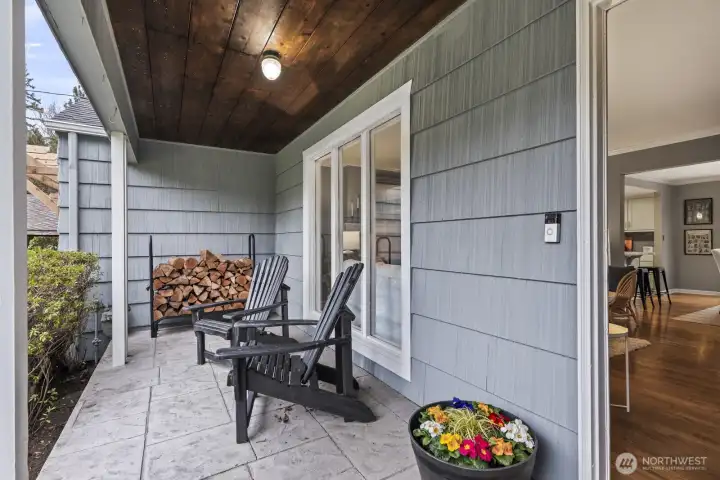 A charming stone walkway at the front of the home leads to a spacious, covered front porch.