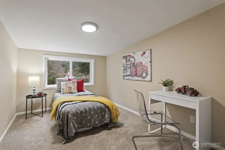 One of four upstairs bedrooms with scenic views.