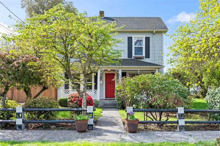 Off the sidewalk through the garden, to that front door.