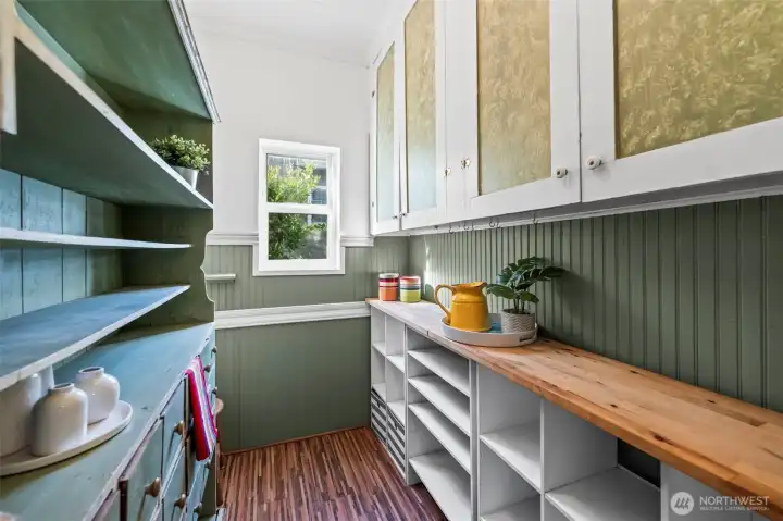 Awesome vintage pantry with built ins on the right and a hutch on the left.