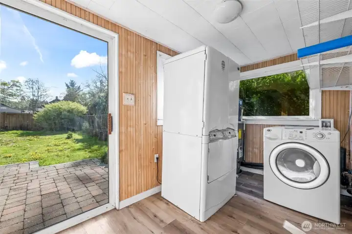 Patio slider out to back yard in the laundry/mud/utility room.