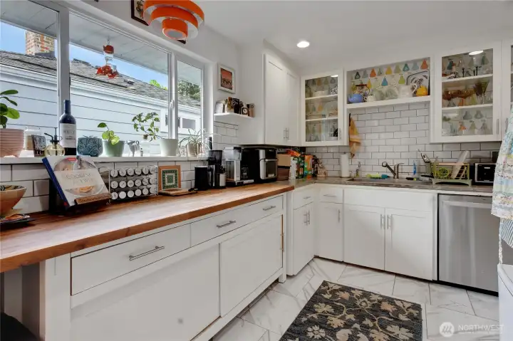 Stylish updated kitchen with stainless steel appliances and ample storage throughout