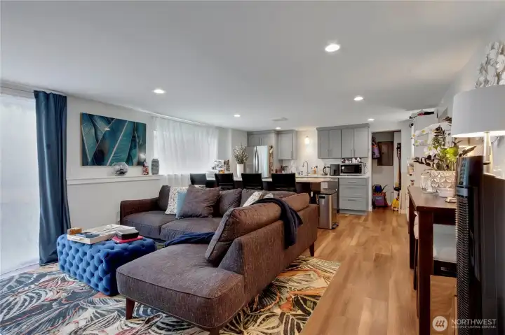 Downstairs provides a living area, kitchen, bathroom, 2 bedrooms, and private outdoor space