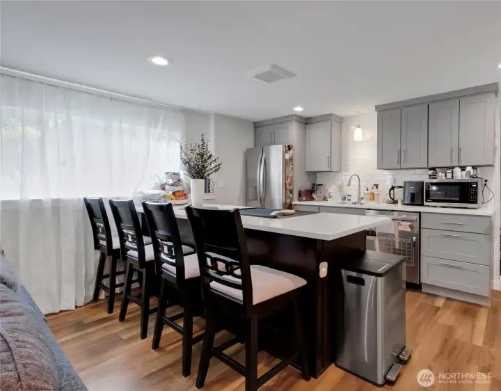 Kitchen installed in 2019 with eating bar, stainless steel appliances, quartz counters, and ample cabinet storage