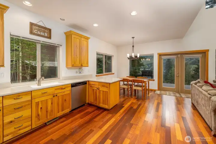 Kitchen with dining area opens to deck.