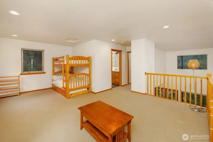 Upper level has large loft for recreational/game room and includes trundle bunk beds for extra sleeping space.