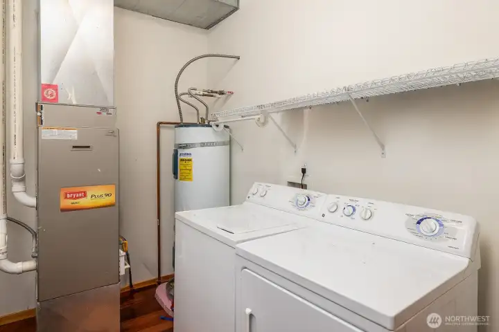 Utility room complete with washer and dryer on main level.