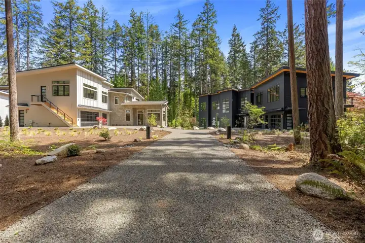 2 new construction luxury modern homes being offered together.  Each home is on a separate 1 acre wooded parcel.