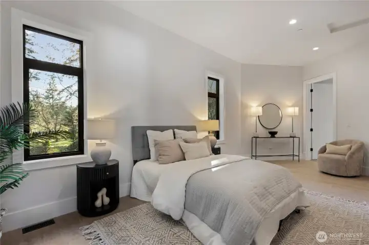 Main floor guest bedroom with ensuite bath