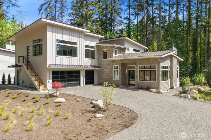 13982 Manzanita Rd NE has a main house with 3 car garage and separate guest suite with it"s own entrance.  The guest suite has a 2nd kitchen, laundry hookups and 3/4 bath with heated tile floors.