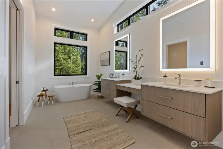 Spa bath with forest views and heated tile floors